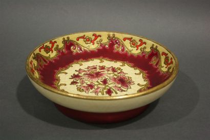 Longwy.
Round bowl in polychrome enamels...
