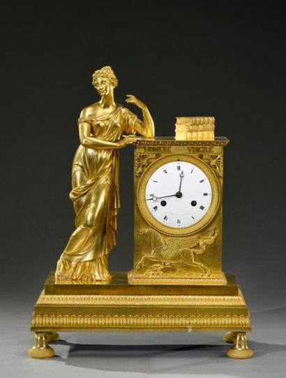 null Homer and Virgil. Large chased and gilded bronze clock, bollard adorned with...