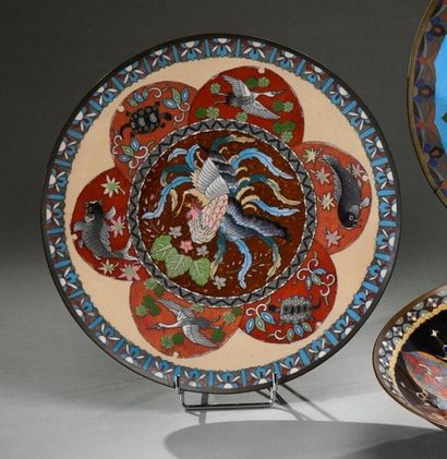 null Cloisonné dish with polychrome decoration of birds, fish, storks and turtles....