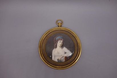 null Miniature on ivory, young woman with a book, presented in a nice bronze frame...