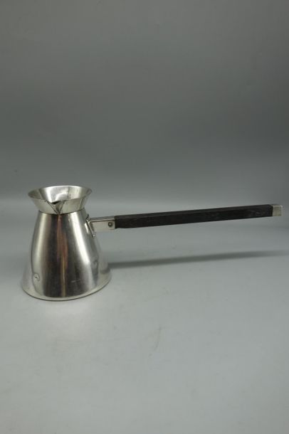null Small truncated cone-shaped silver jug with square-section ebony handle.
Minerva...