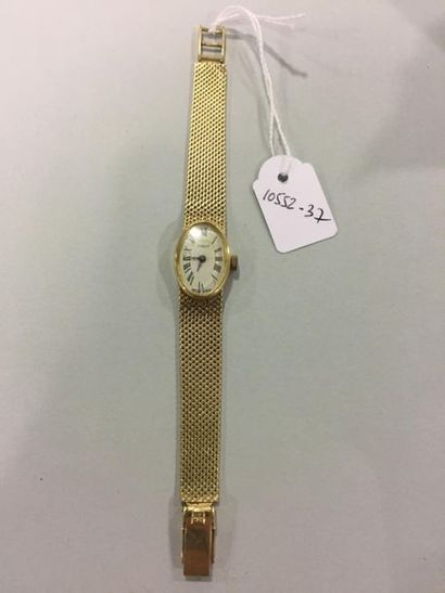 null TISSOT. Bracelet montre de dame en or bas titre. Poids brut : 25,7 gr. AC
Lot...