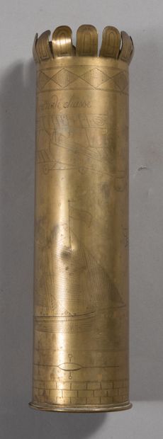 null 75 shell casing, engraved with an aerial combat scene.