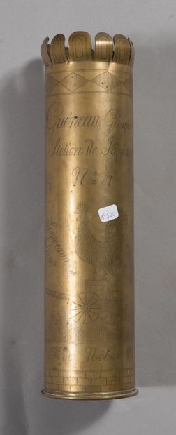 null 75 shell casing, engraved with an aerial combat scene.