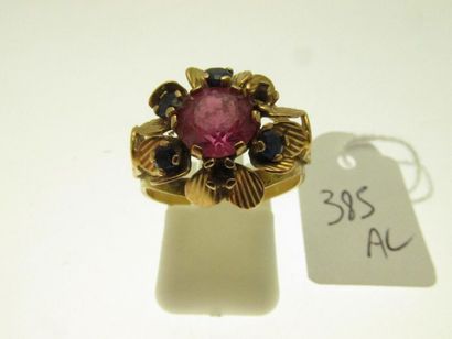 null 1 openworked gold ring with central flower motif set with stones (missing),...