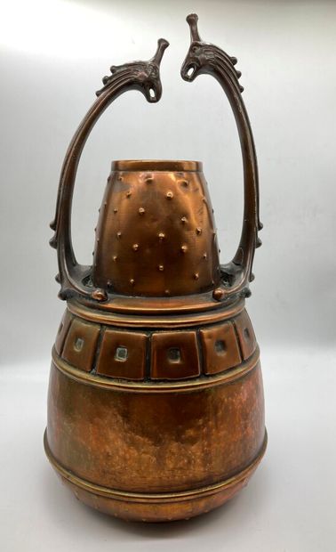 null ISIS 

A copper and metal jar with a shouldered ovoid body and a conical neck...