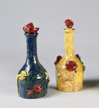 null BENJAMIN 

Two enamelled stoneware bottles, one with a semi-relief decoration...