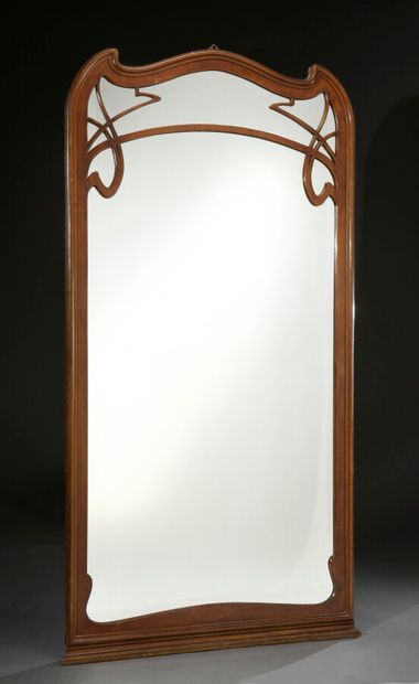 null ART NOUVEAU WORK 

A varnished wood wall mirror with a rectangular view in a...