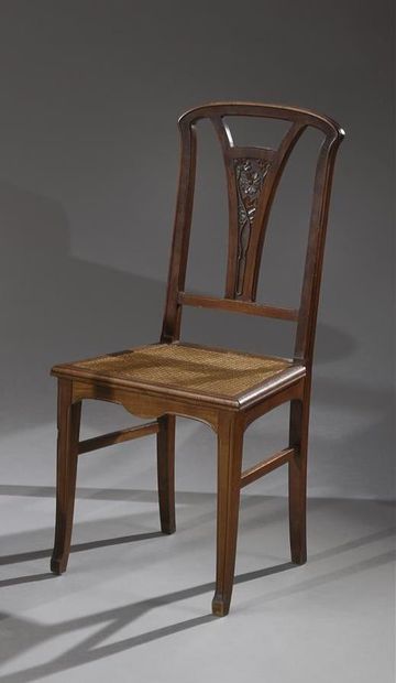 null ART NOUVEAU WORK

Two chairs with a flat back carved with stylized flowers in...