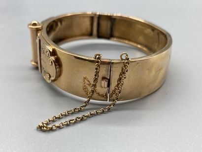 null Bracelet Jonc plat ouvrant ancien en or jaune 18K (750/oo) agrémenté d'un motif...