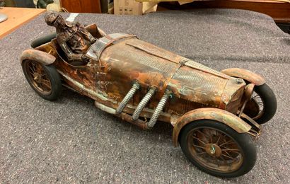 null Sculpture in copper and metal imitating a car driver. 

26 x 67 cm