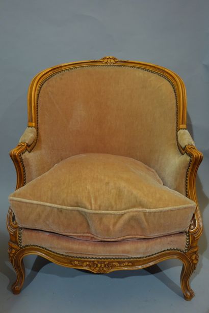 null A Louis XV style gondola armchair in natural wood with mouldings and carvings...