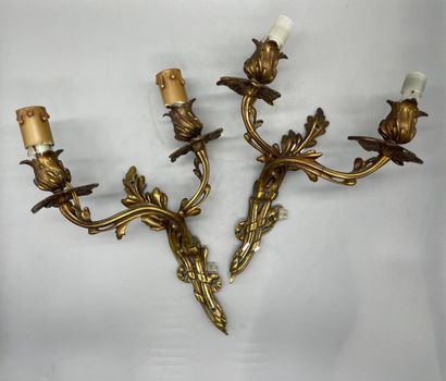 null Three gilt bronze sconces, one pair in the Louis XV style with foliage. 

H....