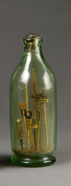null Bottle "of the Passion", with slightly greenish tinted glass, containing the...