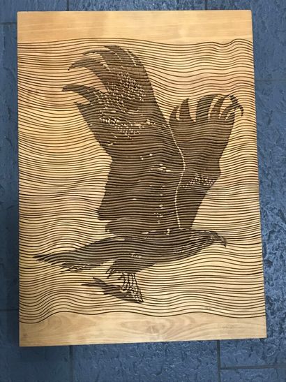  Contemporary wood sculpture decorated with an eagle in flight. 67 x 49 cm. Bears...