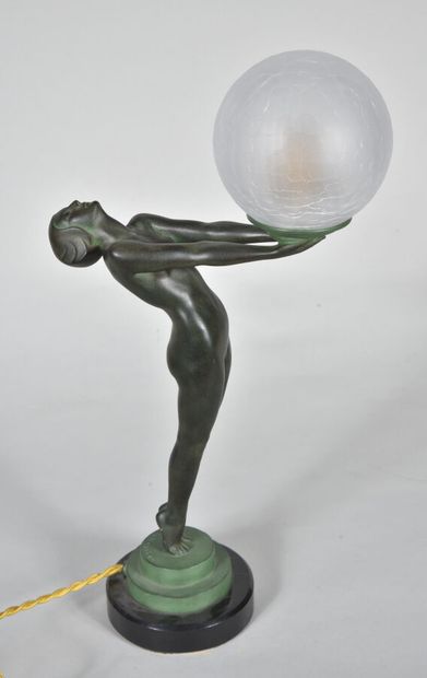  Max LE VERRIER 
"Clarity". Regula lamp with antique green patina on a circular black...