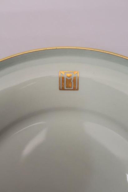  Marcel GOUPY & ROUARD 
Celadon porcelain dinner service with gilded monogrammed...