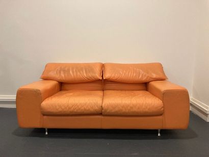Two seater sofa in orange leather. 
H 72...