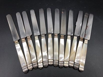 Twelve cheese knives, mother of pearl handles...