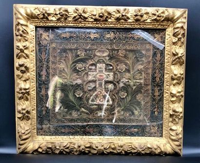  Large reliquary in paperolles decorated with a cross in a frame of palms, flowers,...