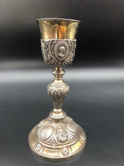 null Chalice in silver chased embossed with medallions depicting the Crucifixion,...