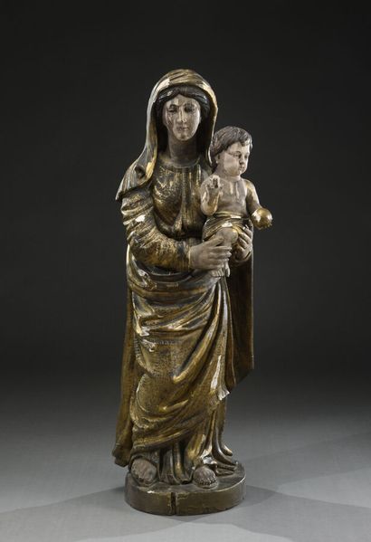 null Vierge à l'enfant bénissant, en bois sculpté, polychromé, doré.

Fin du XVIIème...
