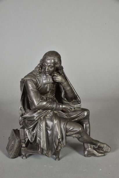null Bronze patiné figurant la littérature représentée par un jeune homme assis tenant...