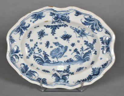 null LYON.

Oblong earthenware dish decorated in blue monochrome with a bird on a...
