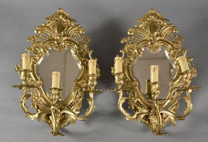 null Pair of sconces in the Louis XV style with rocaille decoration, decorated with...