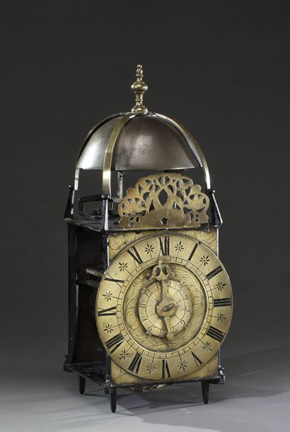 null Lantern movement with a hand, double bronze dial engraved with Roman and Arabic...