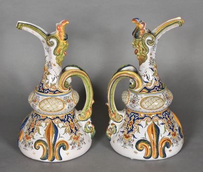null Pair of ewers in the taste of Rouen in polychrome earthenware, decorated with...
