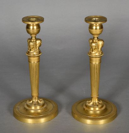 null Pair of candelabras in the Empire style in gilt bronze with fluted shaft topped...
