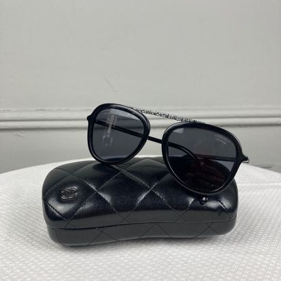 CHANEL. Pair of square black acetate sunglasses,...