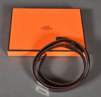 null HERMES Paris. Kelly belt in brown leather and silver metal jewelry. In its ...