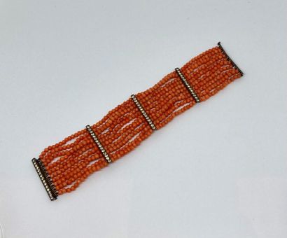 null Bracelet with 10 rows of small coral beads, the bars set with rhinestones and...