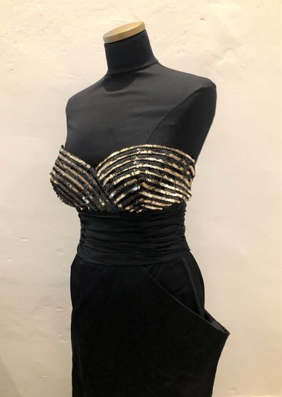  LORIS AZZARO. Long dress in black faille, strapless embellished with lines of gold...