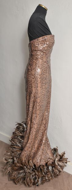 null ANONYMOUS. Strapless long dress in reptile-printed viscose with beige highlights,...