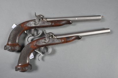 null Pair of percussion pistols with hammers on plates engraved with scrolls and...