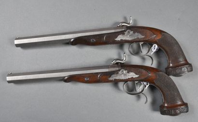null Pair of percussion pistols with hammers on plates engraved with scrolls and...