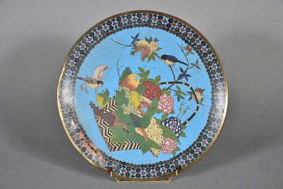Copper and polychrome enamel dish on a blue...