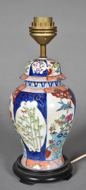 null Two porcelain and polychrome enamel vases, one in the Canton style, decorated...