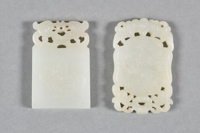 null Two white celadon jade rectangular pendants, one decorated with peaches on one...