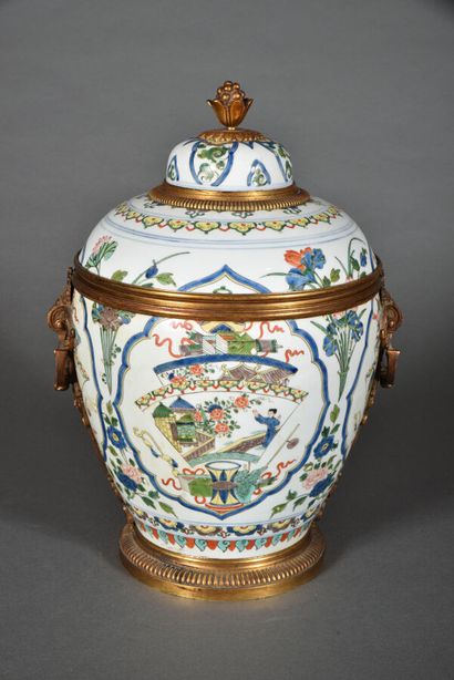 null Covered ovoid vase in porcelain and enamels of the green family style, the body...