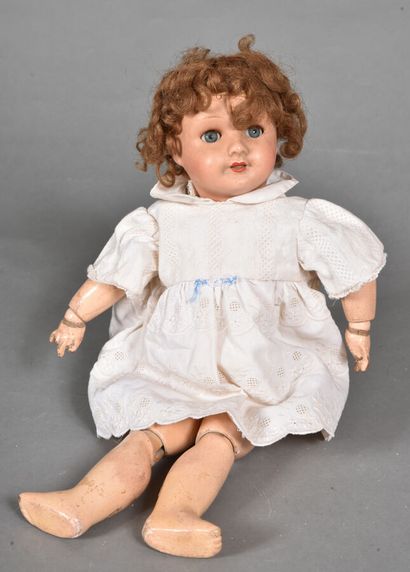null "PARIS 301 6" doll with light brown composition head, blue glass eyes with eyelashes,...