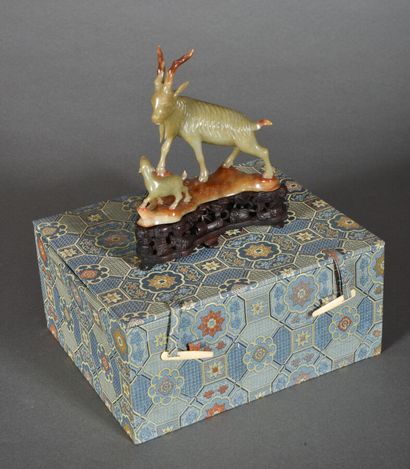null Group in celadon and rust jadeite, representing an ibex and its young. On a...