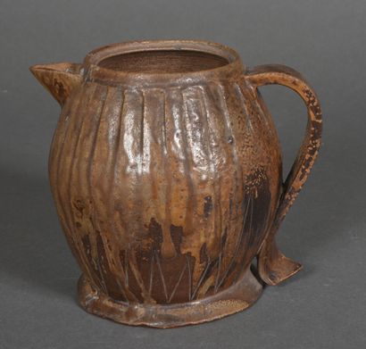 Brown stoneware jug glazed brown and light...