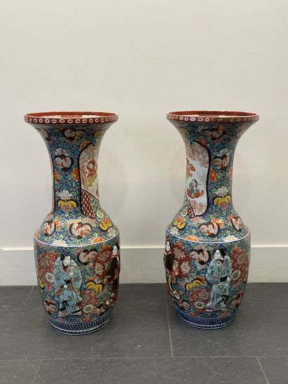 null A pair of large polychrome enameled porcelain vases with high necks and pavilion...