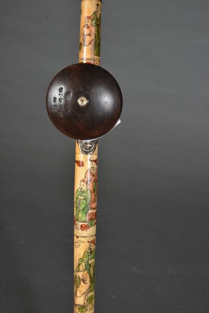 null Bone opium pipe with incised and polychrome characters, the plate in embossed...