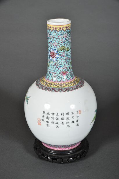 null A porcelain and polychrome enamel bottle vase with a spherical body and long...