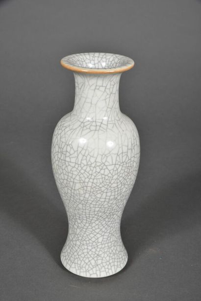 Cream glazed stoneware baluster vase. 
China,...